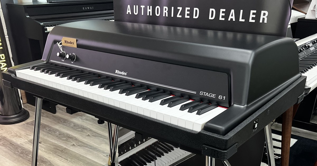 Rhodes Stage 61 in front of a Rhodes Authorized Dealer banner